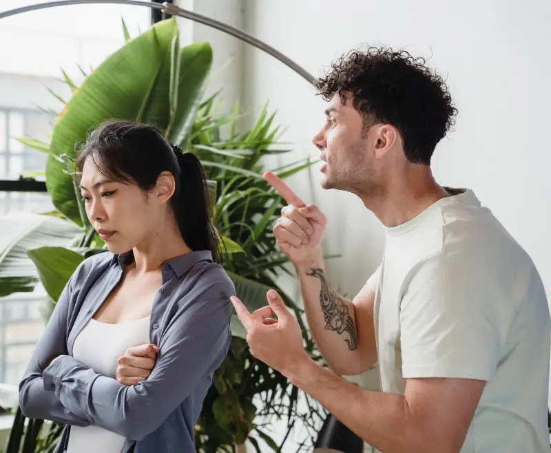 A man and woman are standing next to each other.