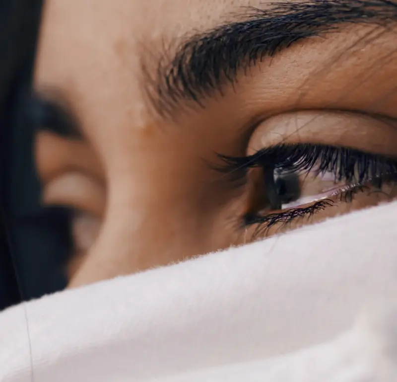 A close up of the eye and the face of a person